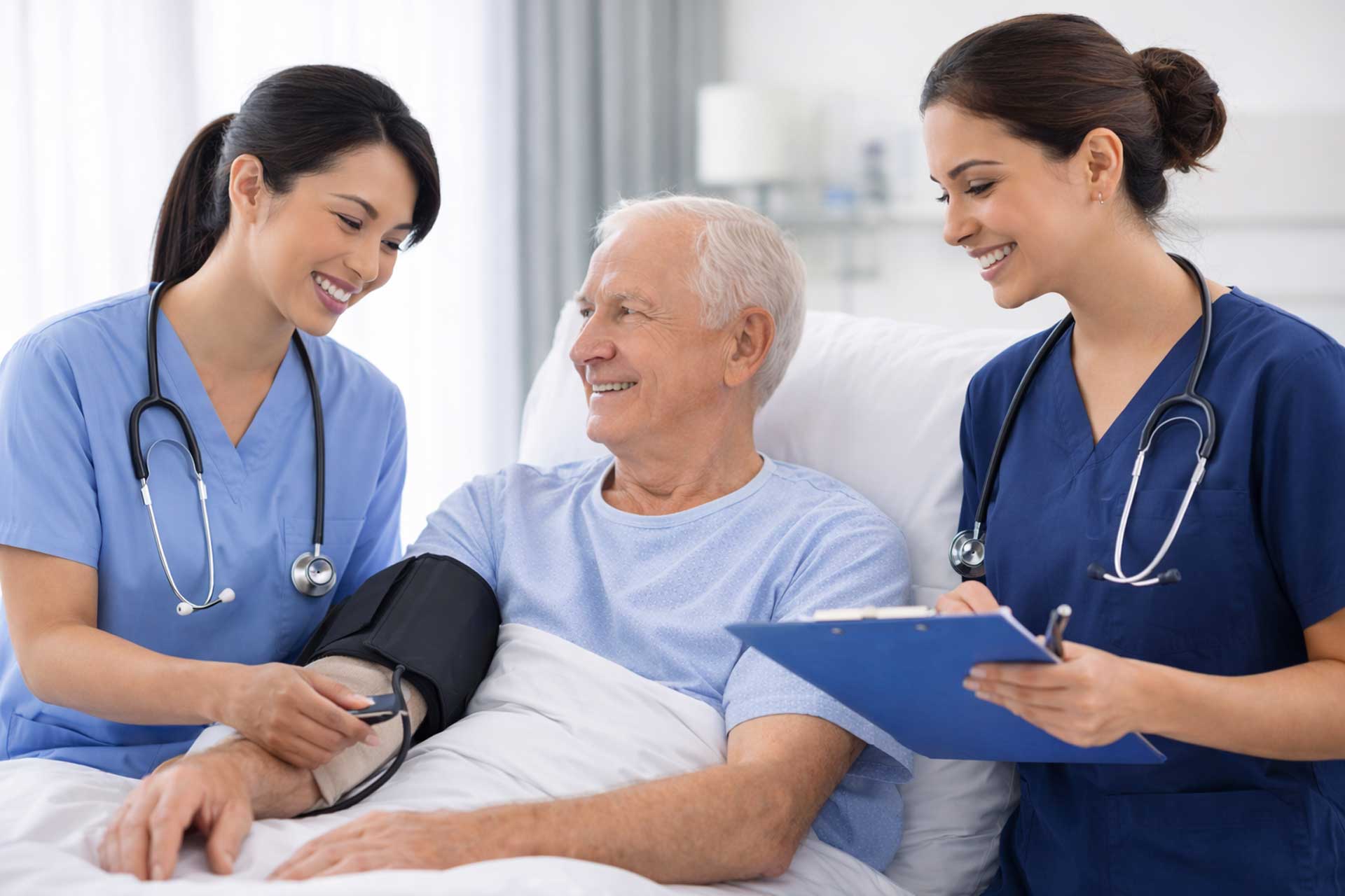 nurses helping patient